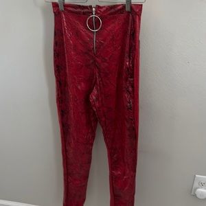 Red snake vinyl pants